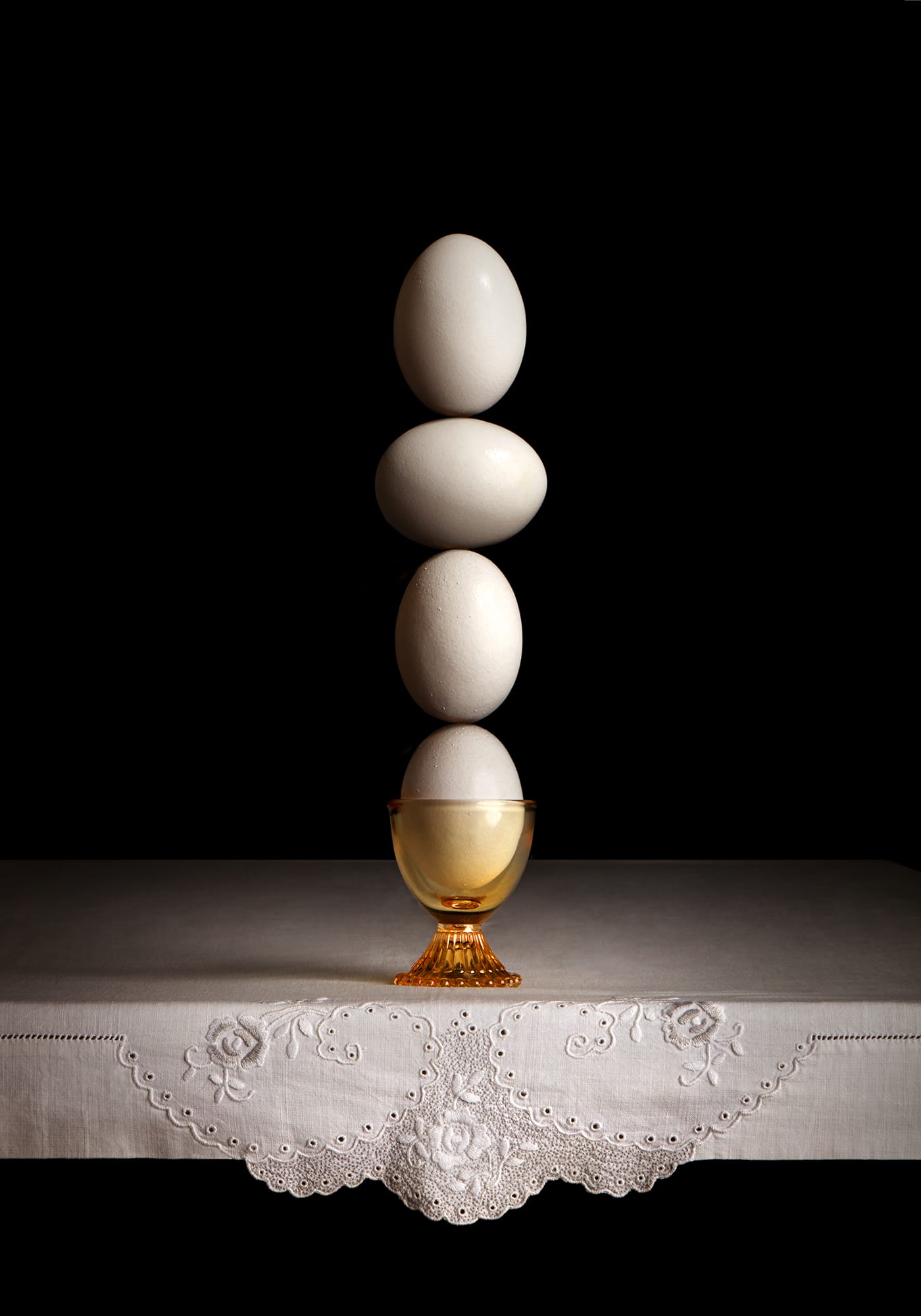 Four white eggs in balance